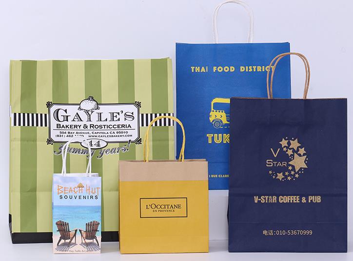 Bán buôn logo tùy chỉnh có thể tái chế túi giấy kraft mua sắm màu nâu với tay cầm phẳng xoắn