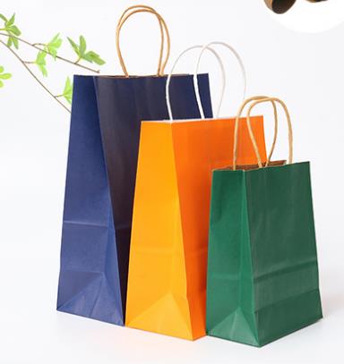Bán buôn logo tùy chỉnh có thể tái chế túi giấy kraft mua sắm màu nâu với tay cầm phẳng xoắn