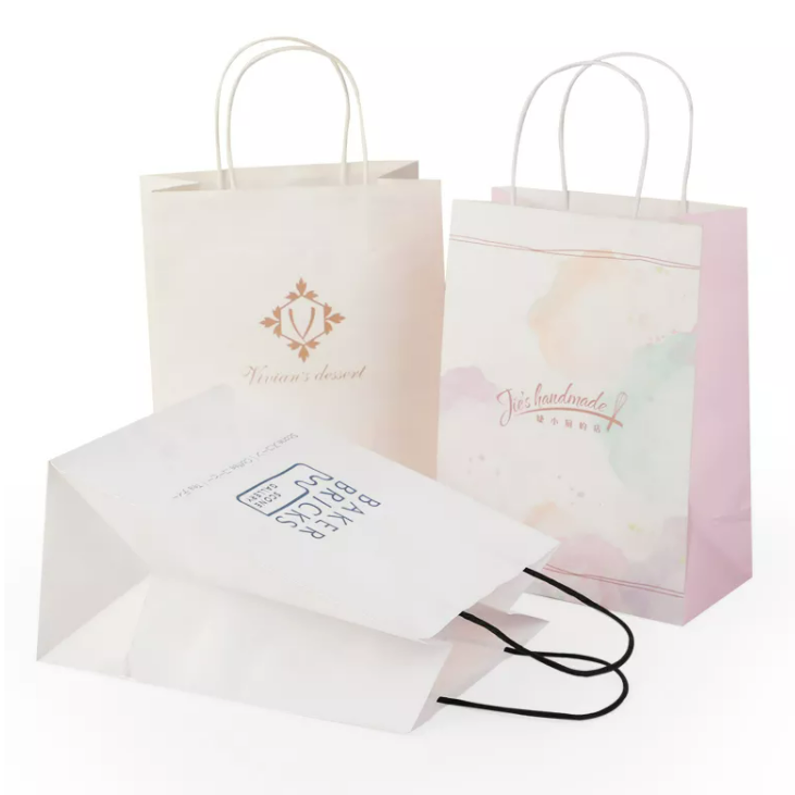 Bán buôn logo tùy chỉnh có thể tái chế túi giấy kraft mua sắm màu nâu với tay cầm phẳng xoắn
